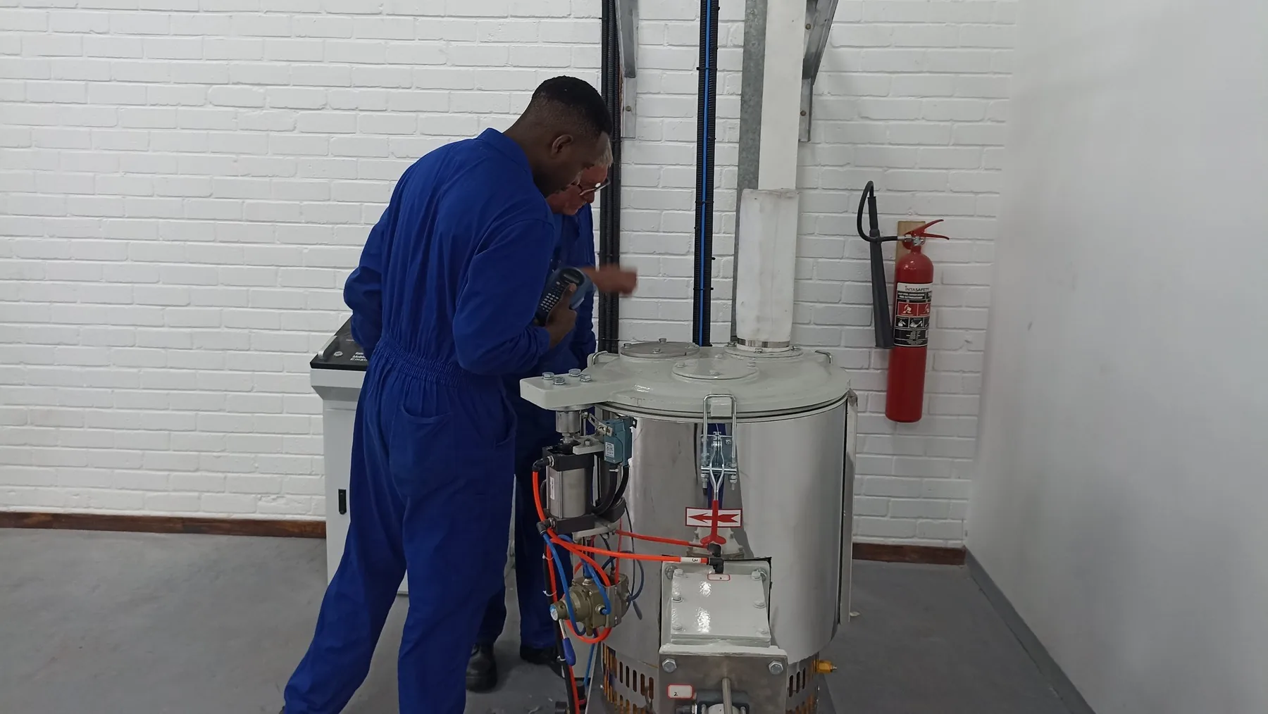 VAS technicians inspecting pneumatically actuated equipment